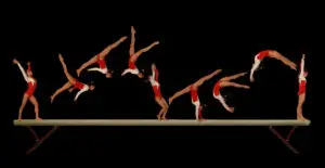 Gymnast practicing a beam series with controlled movement, focus, and precise body alignment.
